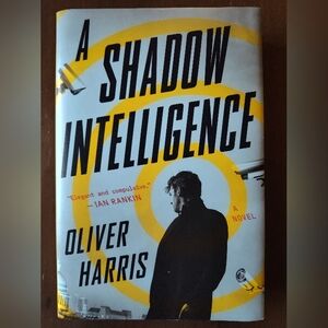 A Shadow Intelligence by Oliver Harris - Yellow and Black Cover